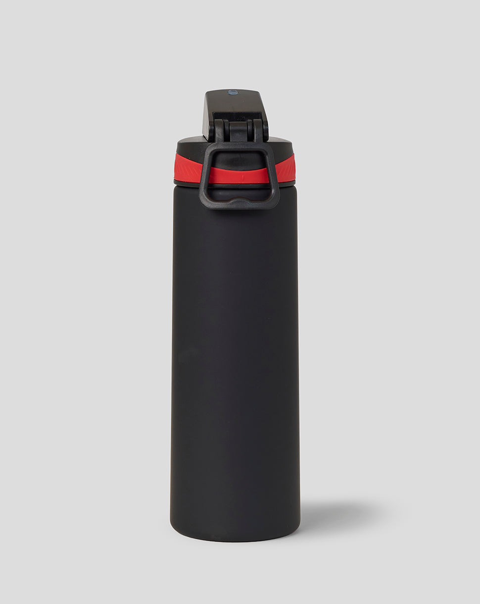 Black water bottle with red band on a light gray background