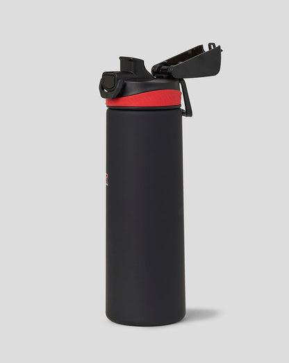 Black water bottle with a red band on a light gray background