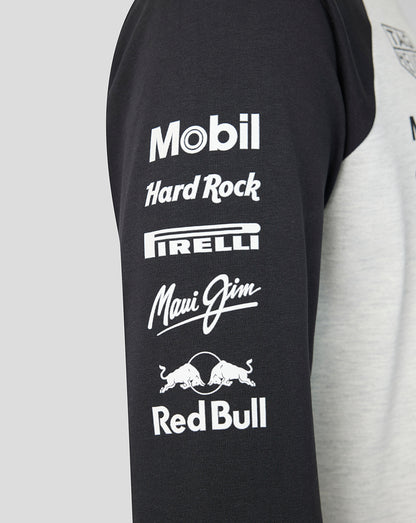 Black sleeveless shirt with various brand logos on a gray background