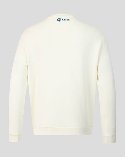Back view of cream Haas Team USA flag sweater with a small blue logo at the neckline.