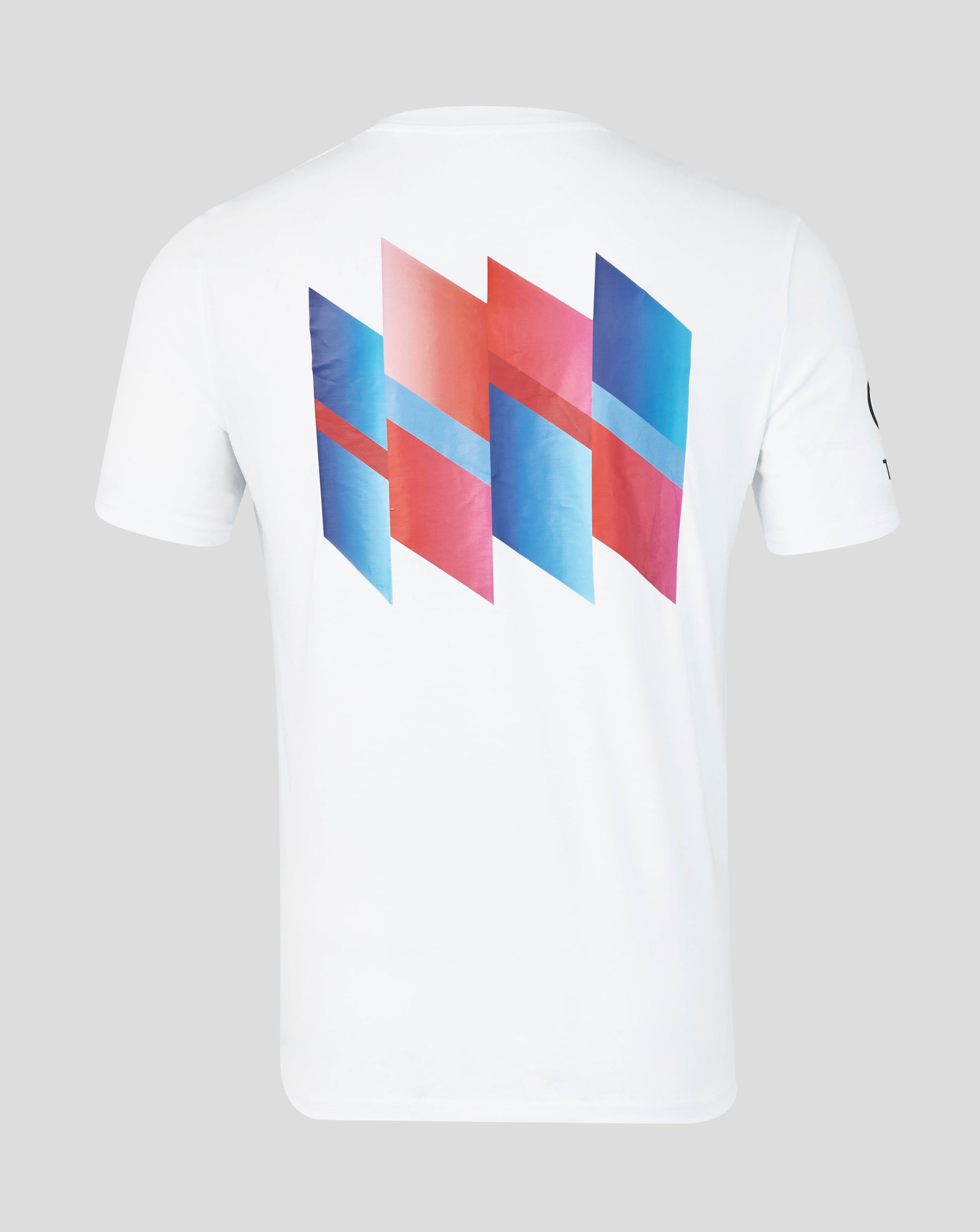 White t-shirt with colorful geometric design on a gray background