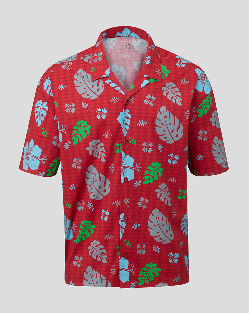 Red Hawaiian shirt with tropical leaf pattern on a white background