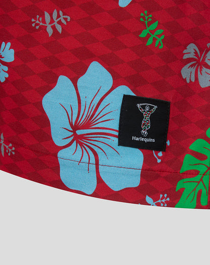Red fabric with blue floral patterns and a Harlequins logo tag.