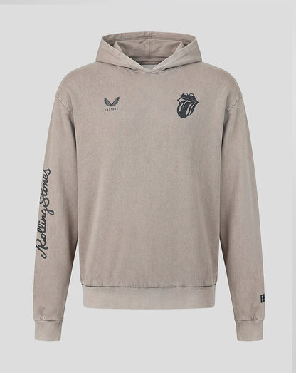 A beige hooded sweatshirt featuring the Rolling Stones tongue and lips logo on the left chest, a small wing logo with 'Castore' on the right chest, and 'Rolling Stones' written vertically in script down the right sleeve, shown against a light gray background.