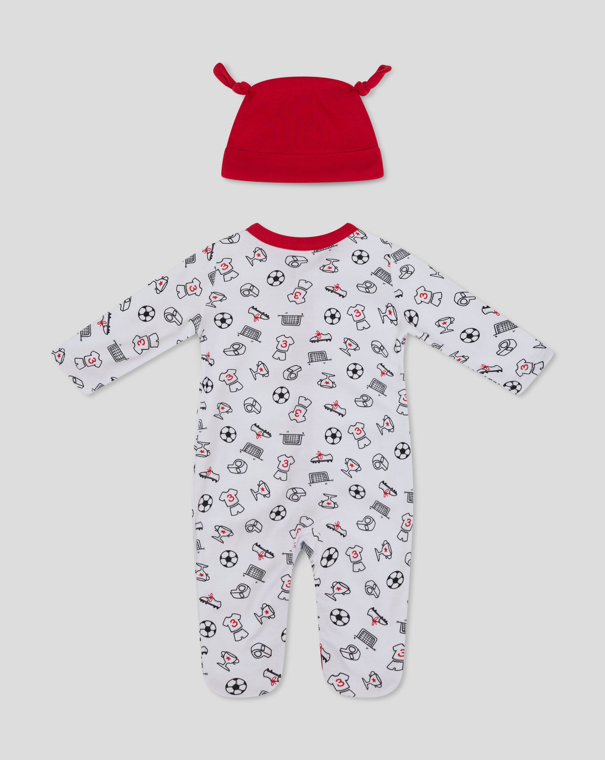 Red knotted baby hat above a white babygrow with soccer ball and trophy icons