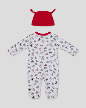 Red knotted baby hat above a white babygrow with soccer ball and trophy icons
