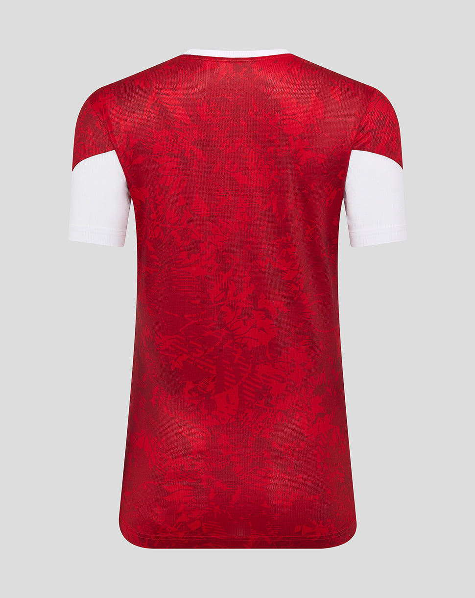Back view of Athletic Club women's home shirt in red with white sleeve cuffs and subtle abstract print