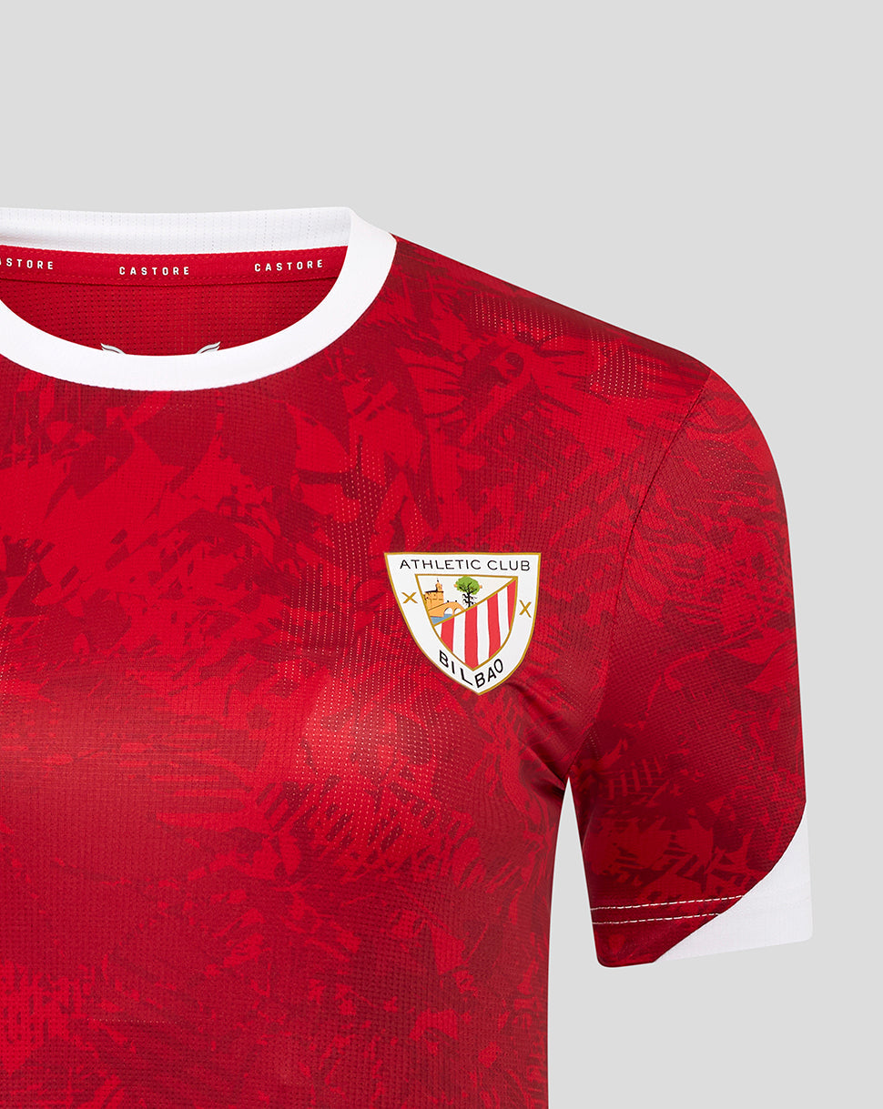 Close up of the red Athletic Club jersey showing the left chest crest and white sleeve cuff