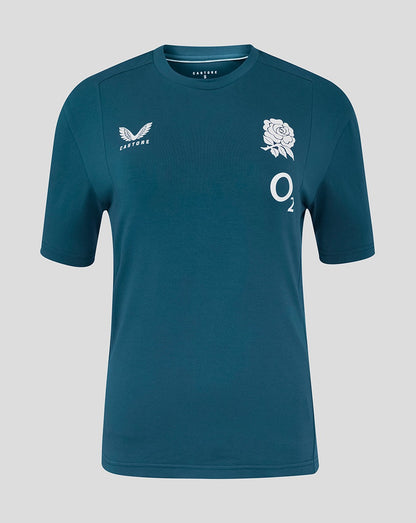 Teal sports jersey with branding and emblem on a gray background