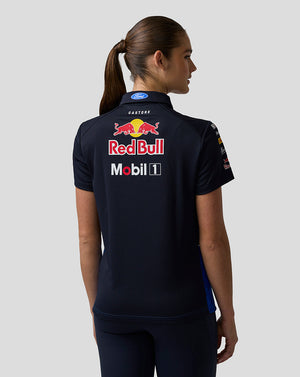 Person wearing a black polo shirt with Red Bull and Mobil 1 logos on the back.