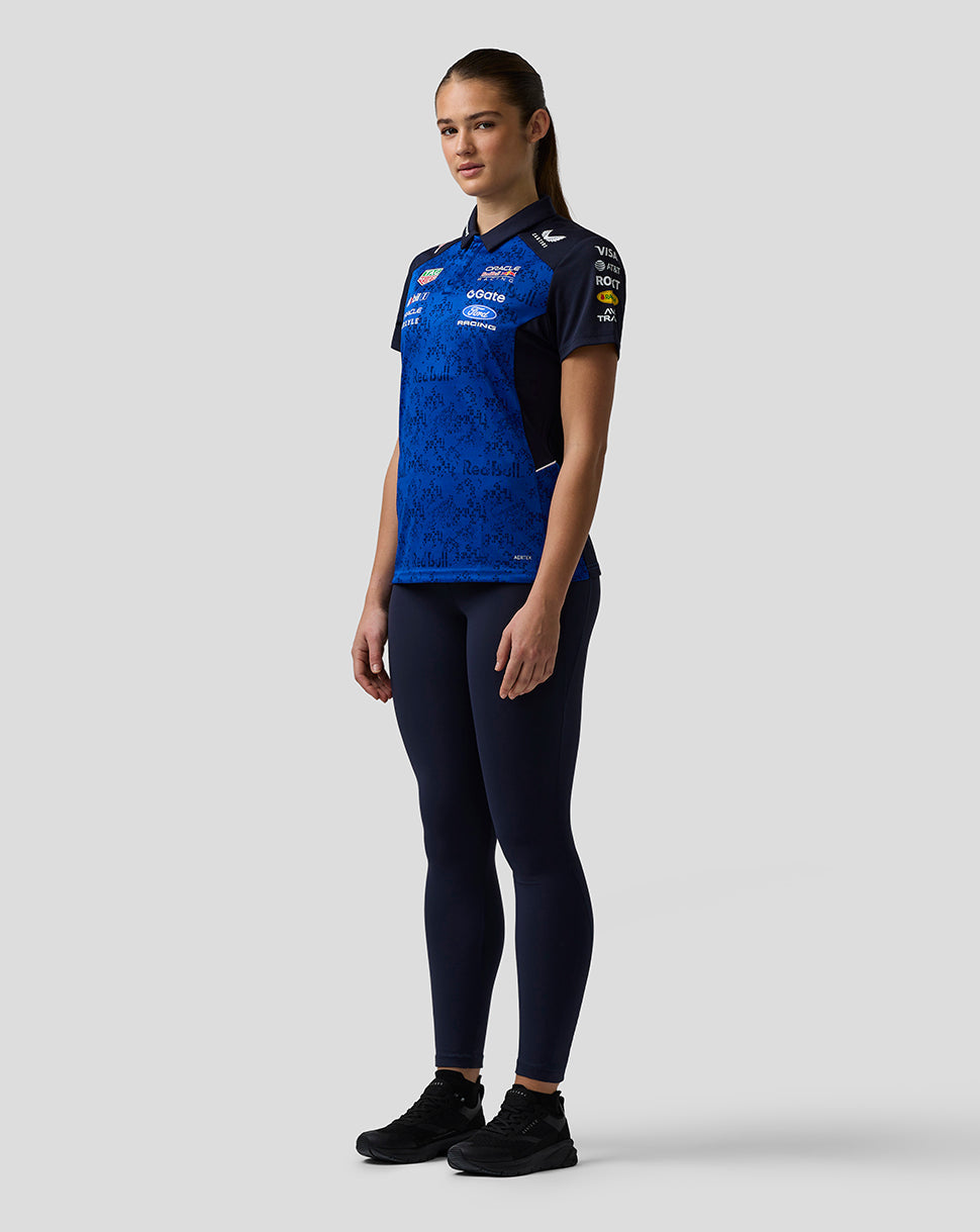 Person wearing a blue sports jersey with visible branding on a white background