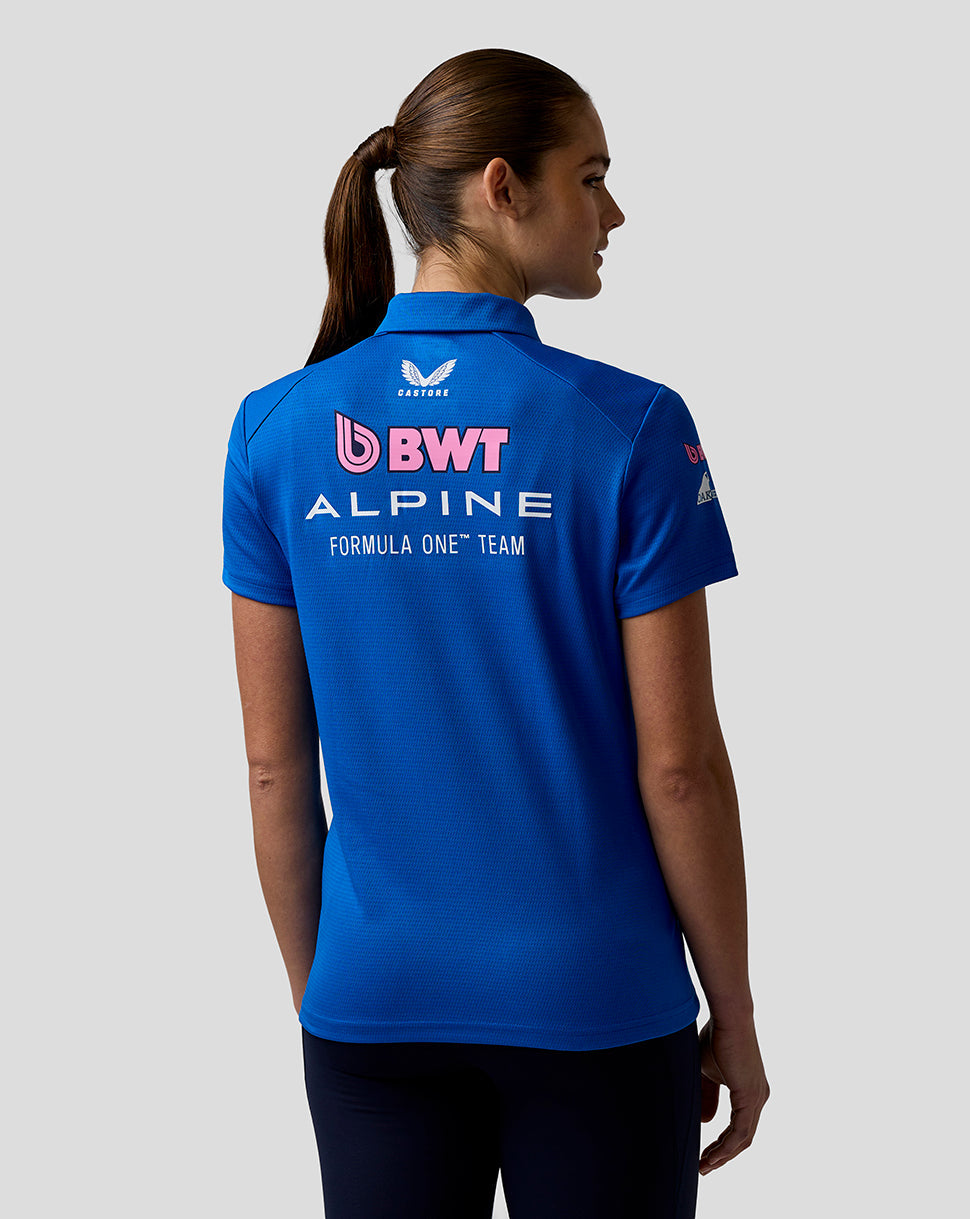 Back view of a model wearing the blue Official Women’s BWT Alpine Formula One Team Polo Shirt displaying large BWT Alpine logo