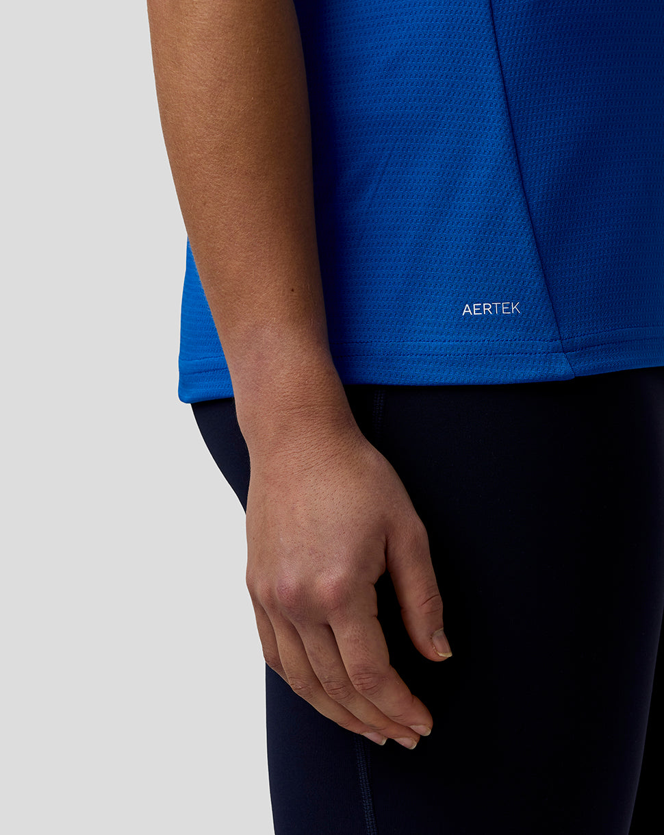 Blue official Womens BWT Alpine Formula One Team polo shirt close up of lower side with AerTek branding