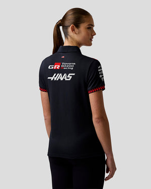 Person wearing a black polo shirt with Toyota Gazoo Racing and HKS logos on the back.