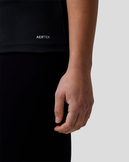 Person wearing a black shirt with 'AERTEK' logo