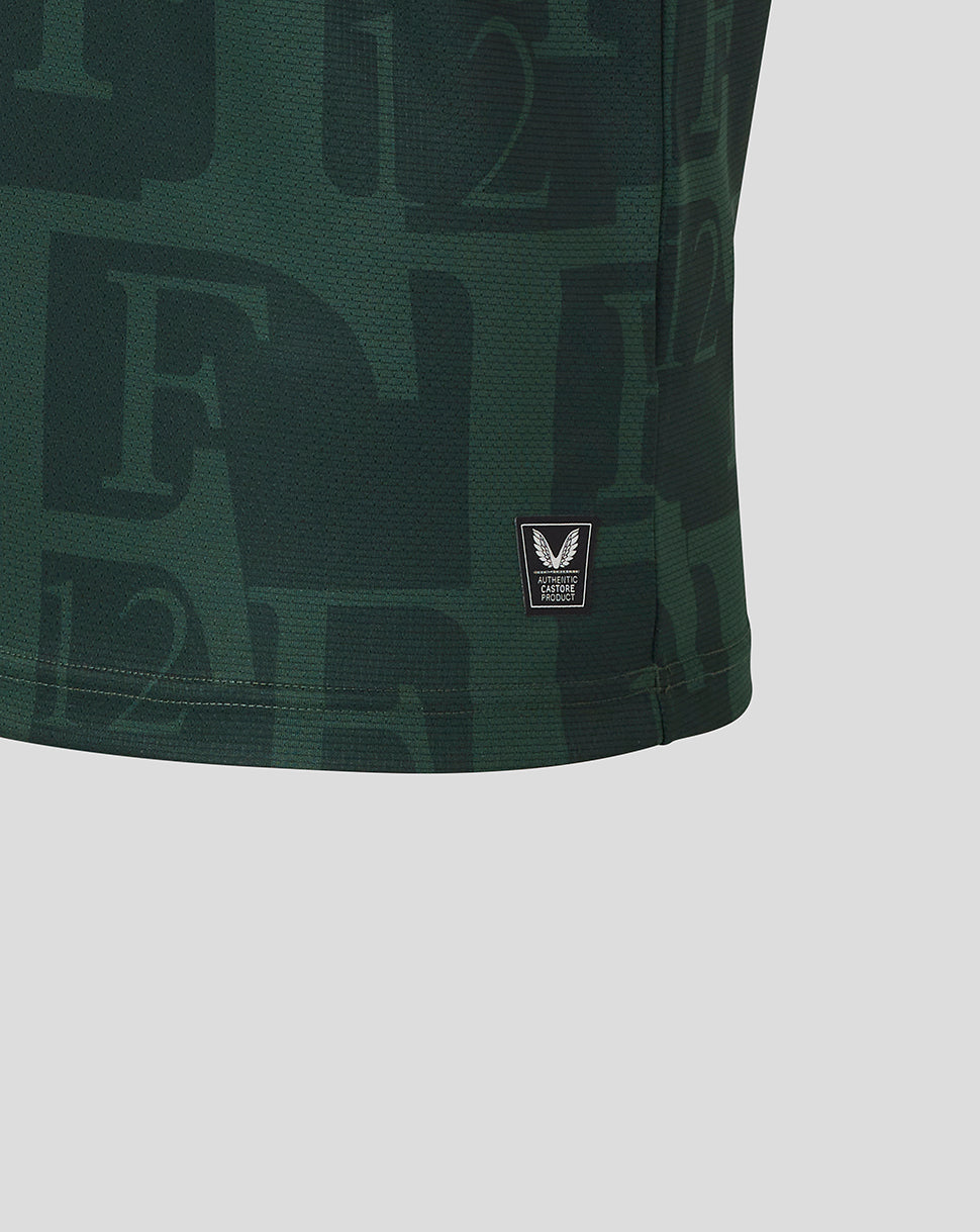 Hem detail of dark green Twelfth shirt with Authentic Castore Product badge.