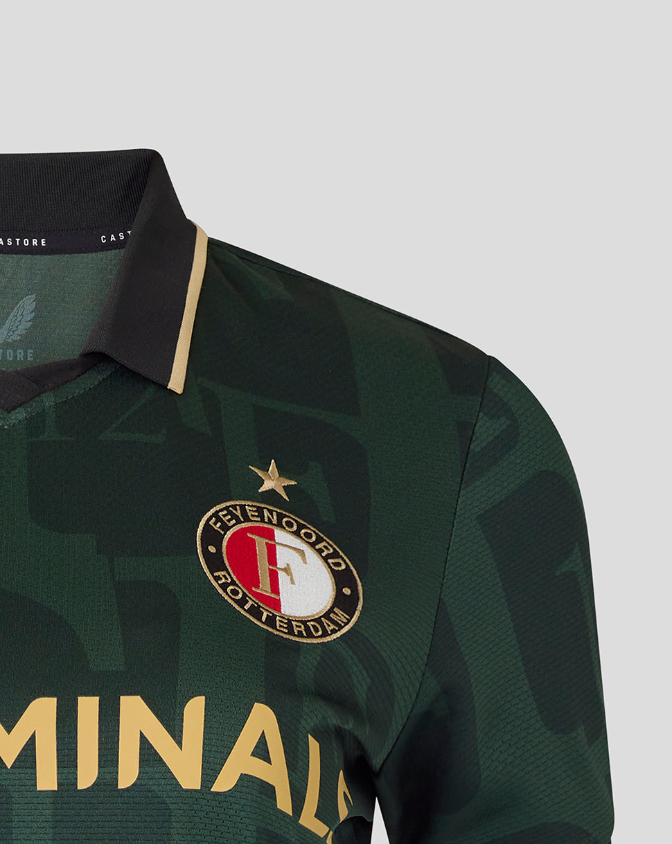 Close-up of Feyenoord crest with gold star above on dark green Twelfth Shirt and bold gold sponsor lettering across the chest.