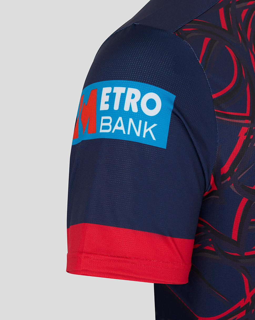 Navy and red sports jersey with Metro Bank logo on a gray background