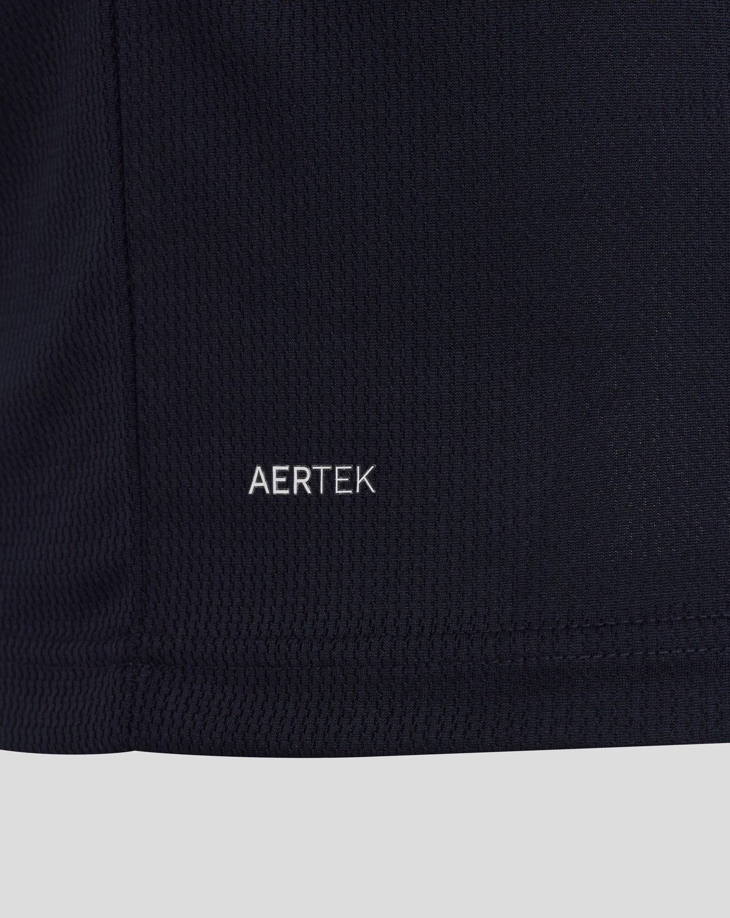 Close-up of a black fabric with 'AERTEK' branding.