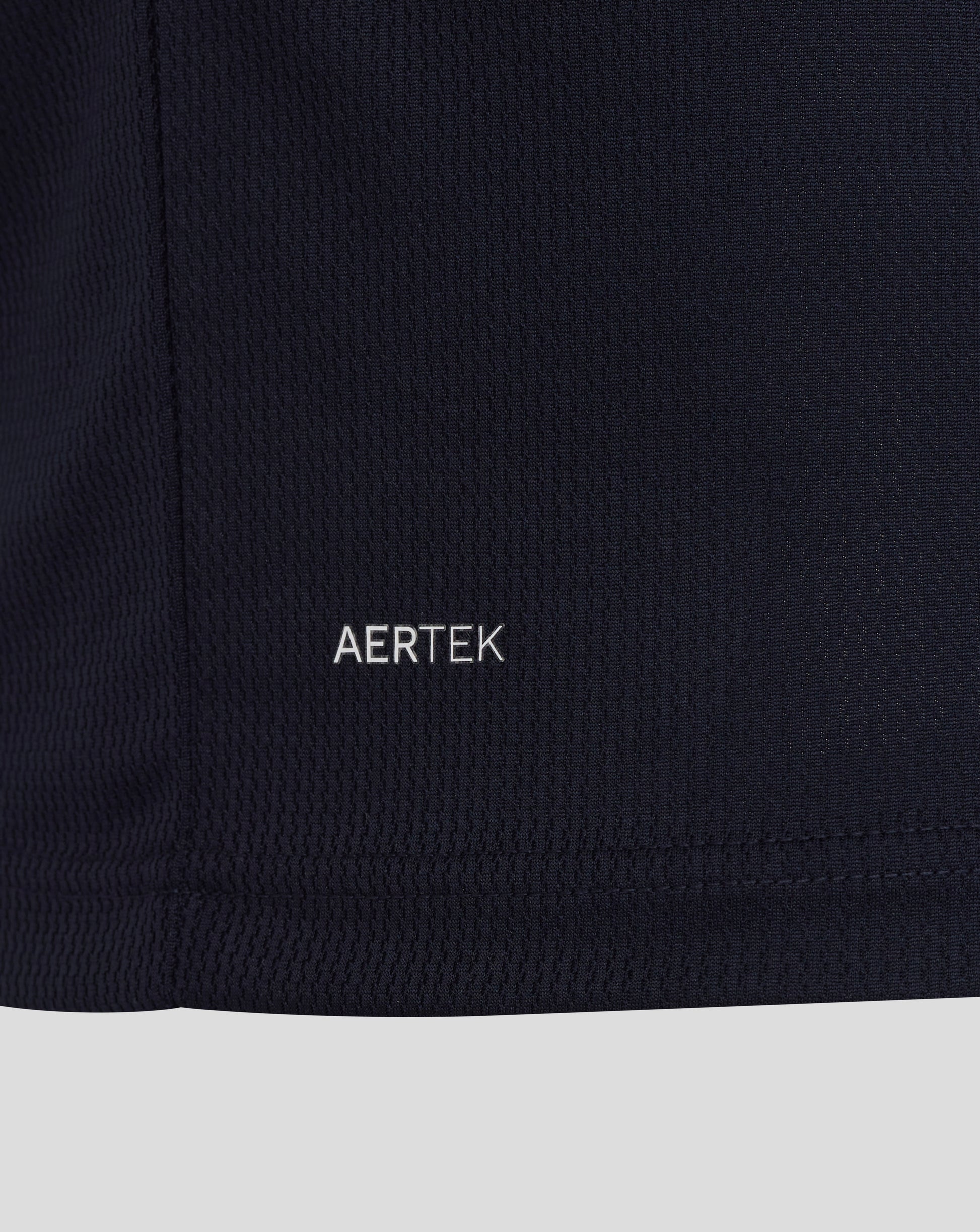 Close-up of a black fabric with 'AERTEK' branding.