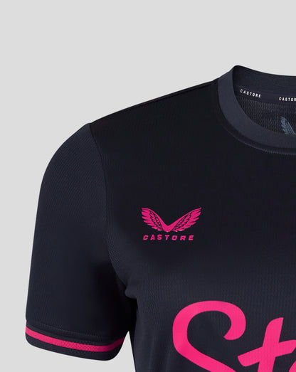 Black football jersey with pink accents and 'Castore' logo on a light gray background
