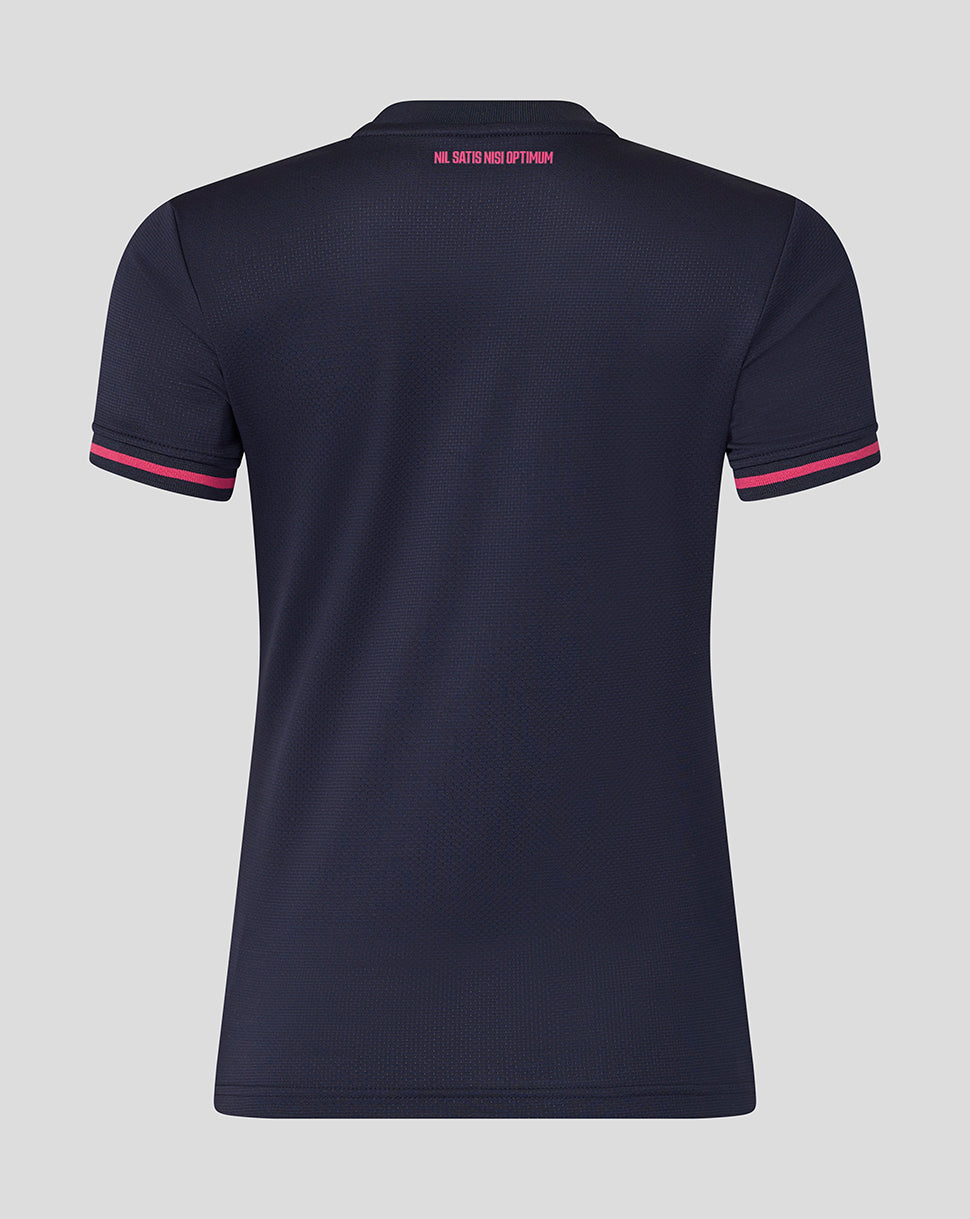 Navy blue polo shirt with pink accents on a gray background