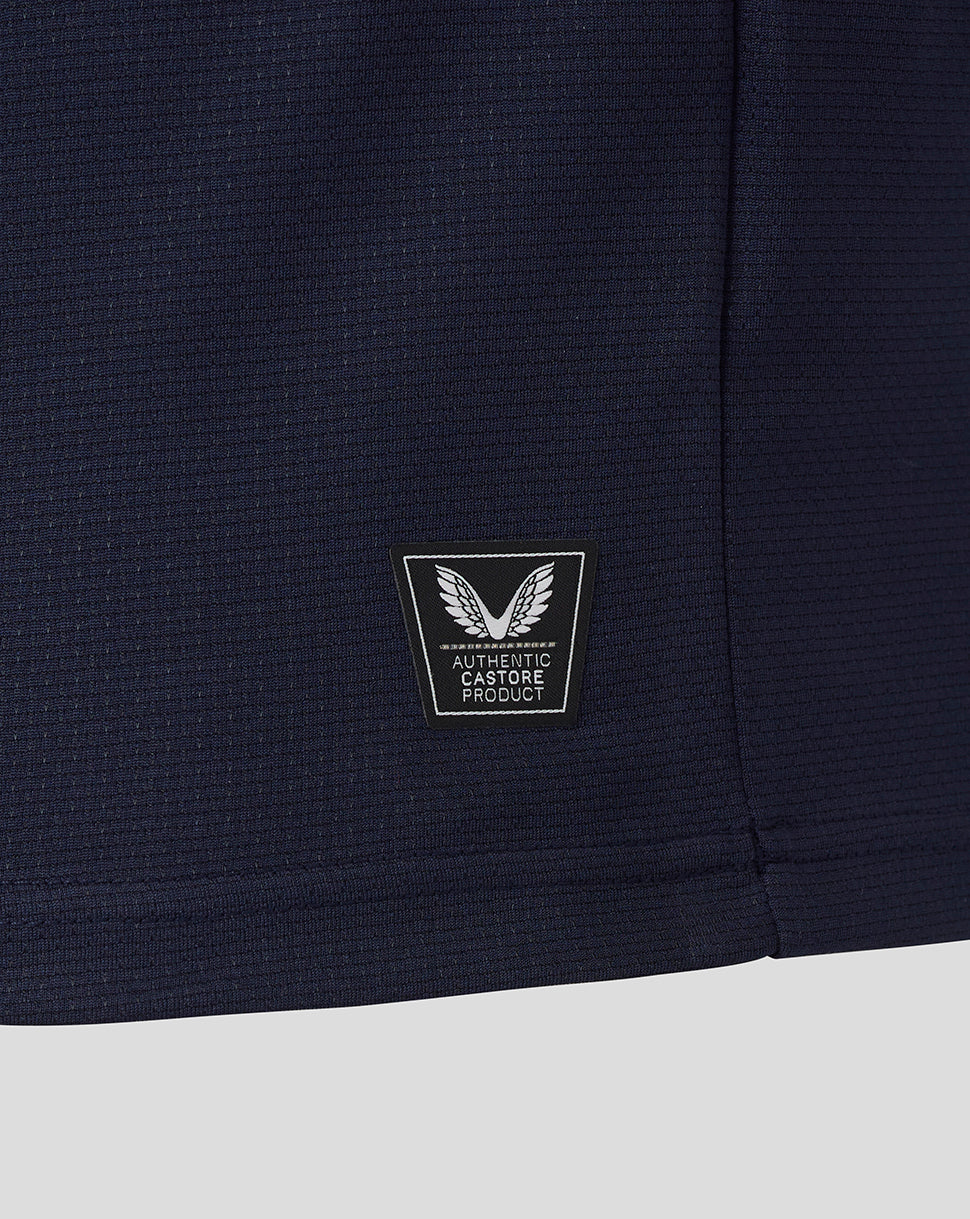Navy blue fabric with a logo patch on a white background