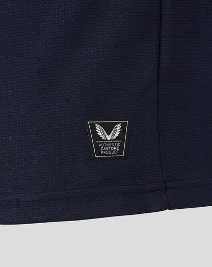 Navy blue fabric with a logo patch on a white background