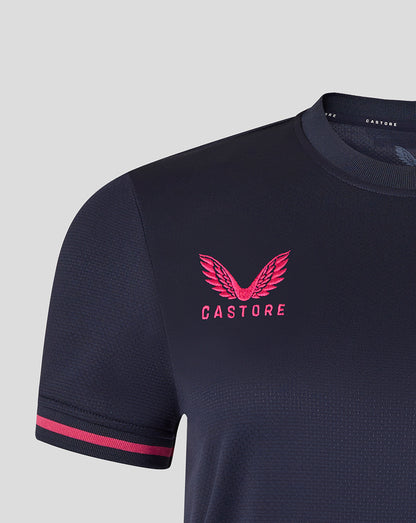 Navy cycling jersey with pink accents and 'Castore' logo on a light gray background
