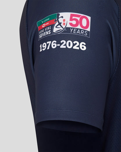 Navy blue shorts with a 50th anniversary logo on a light gray background