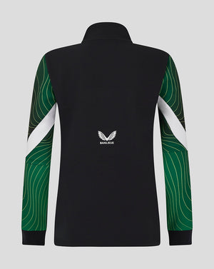 Back view of black Feyenoord women's 24/25 third matchday anthem jacket with green patterned sleeves and Banlieue logo on the lower back.