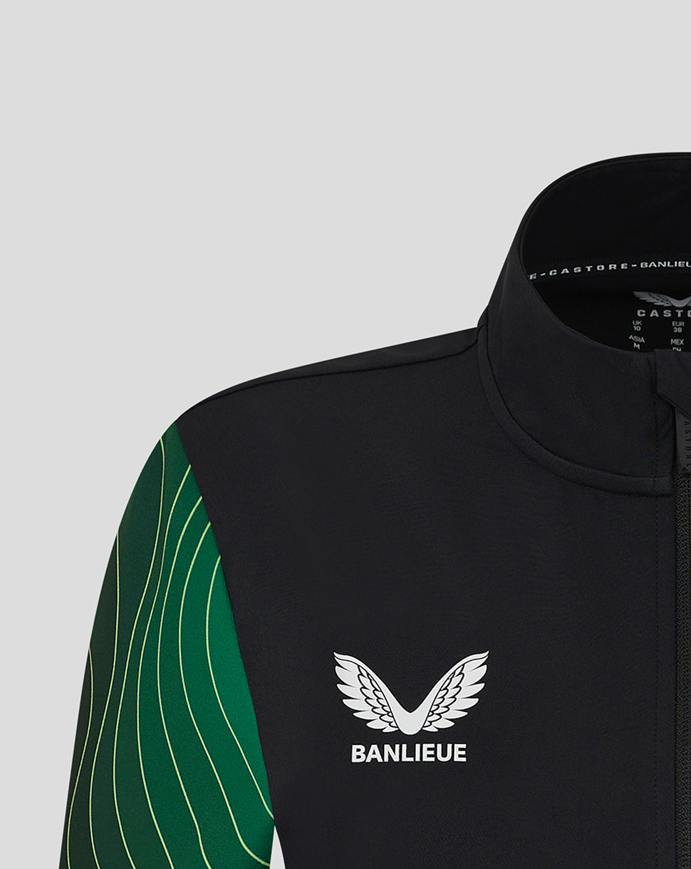 Close up of the chest shows the Banlieue emblem on black fabric with green patterned sleeves from the Feyenoord jacket.