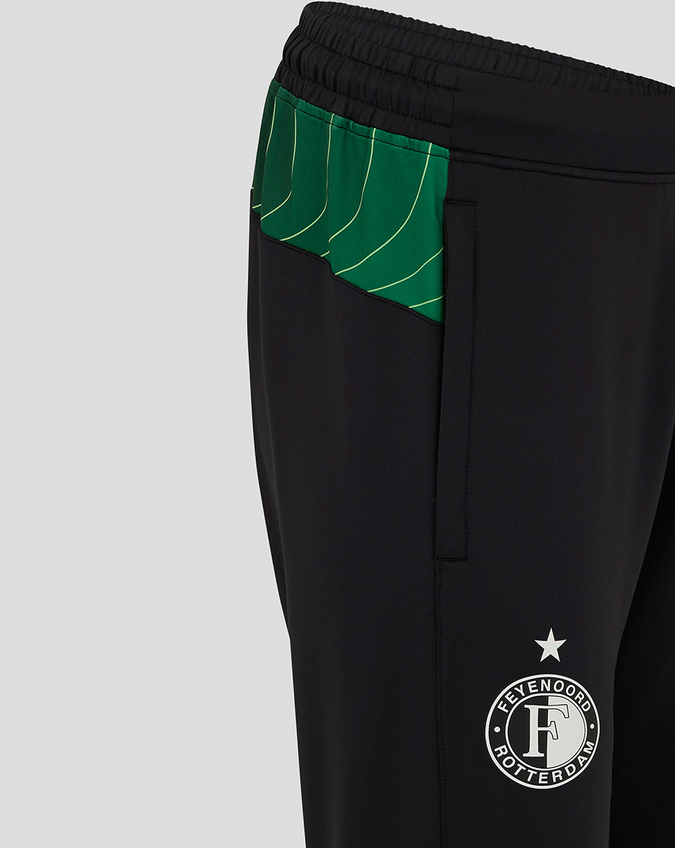 Close up of green patterned waistband and Feyenoord crest on black pants with side pocket detail