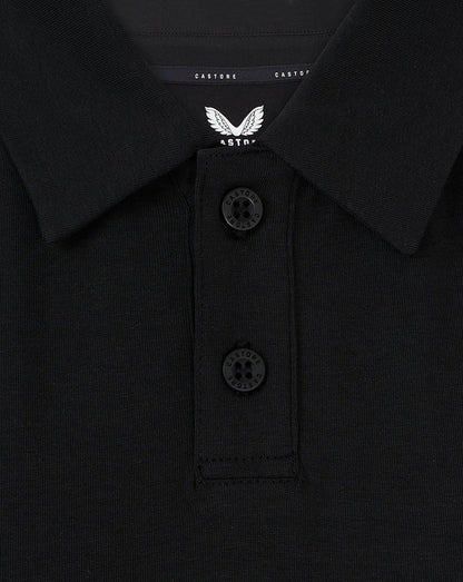 Close-up of black FC Twente Travel Polo collar with a two-button placket and Castore wings branding on the chest