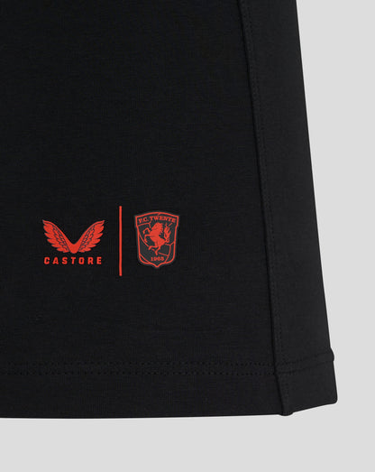 Chest view of black FC Twente Travel Polo showing the FC Twente crest and Castore branding