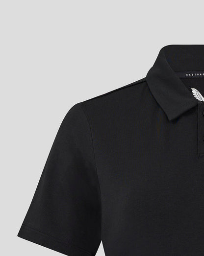 Close-up of black Travel Polo collar with Castore branding and white wing emblem on the chest