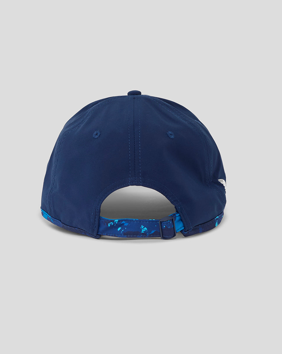 Navy blue cap with a patterned brim on a light gray background