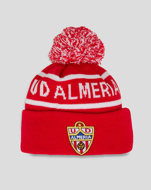 Red Almeria Junior bobble hat with white stripes, fluffy red and white pom pom, and crest on the cuff.