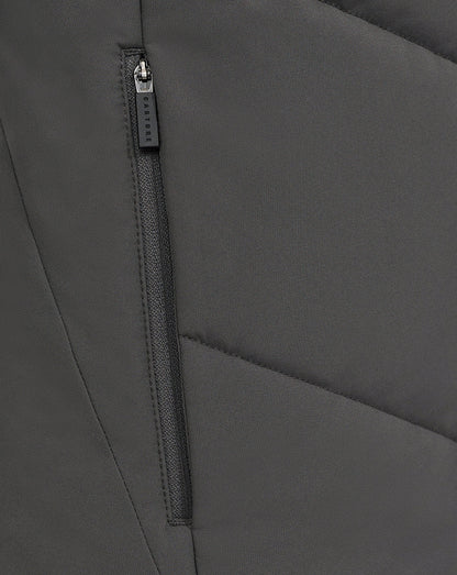 Close up of a vertical zipper pocket on the gray Castore Feyenoord training jacket with panel stitching.