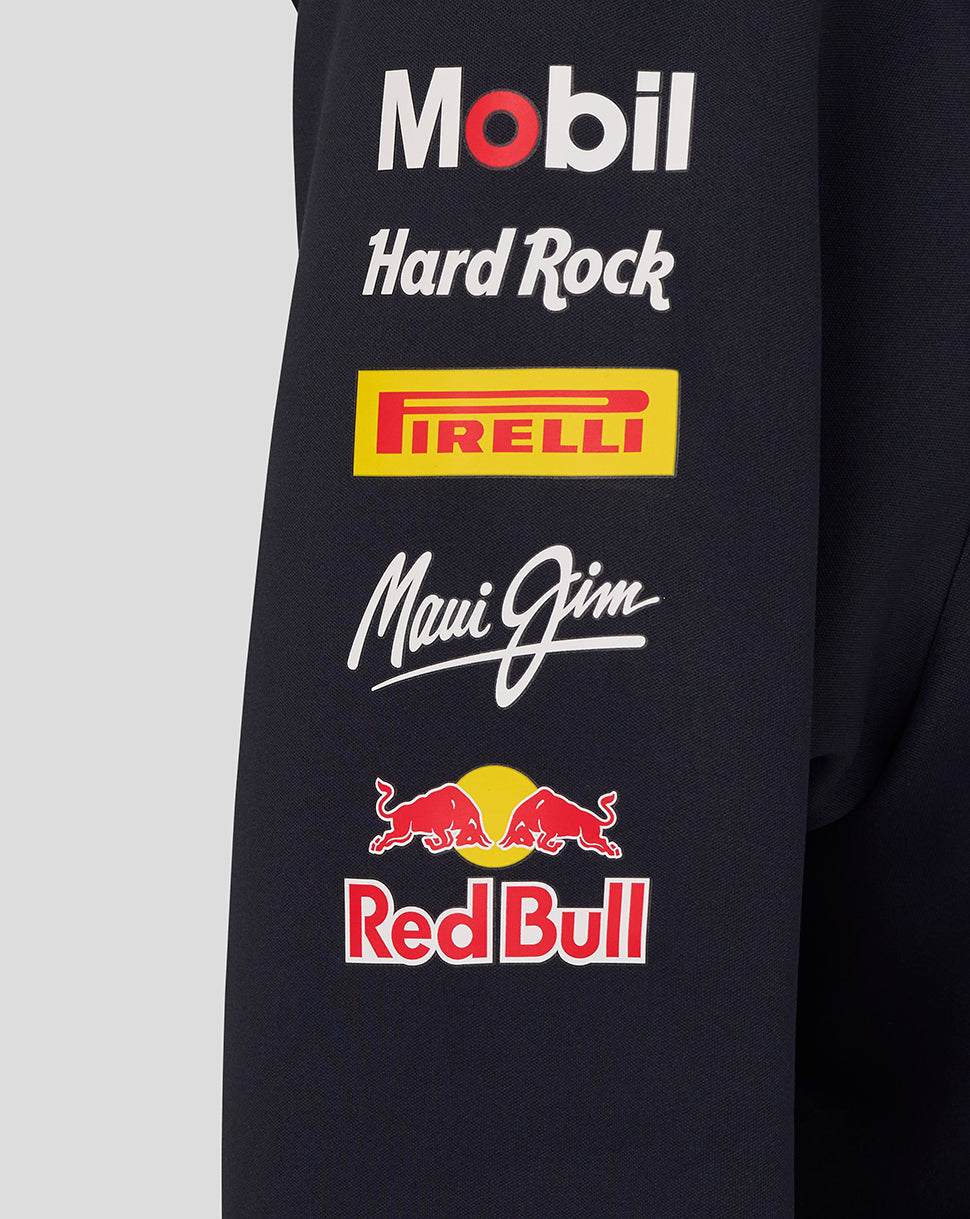 Black jacket with various brand logos including Mobil, Hard Rock, Pirelli, Maui Jim, and Red Bull on a gray background.