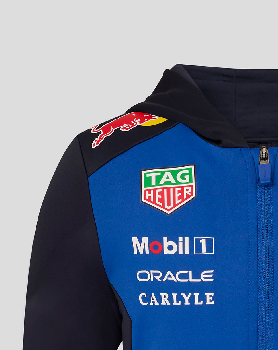 Blue and black jacket with various brand logos on a gray background