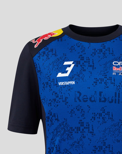 Close-up of a blue and black Red Bull Racing short-sleeve jersey with the number 3, Verstappen name, and Red Bull logo on the shoulder, shown against a light gray background.