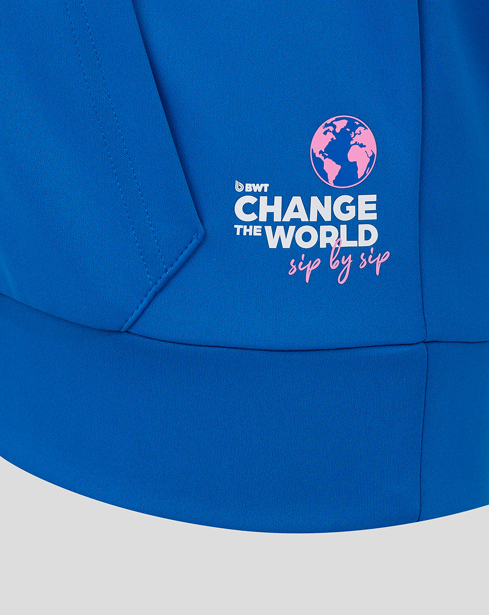 Lower back panel of the blue BWT Alpine hoodie featuring Change the World sip by sip graphic and globe
