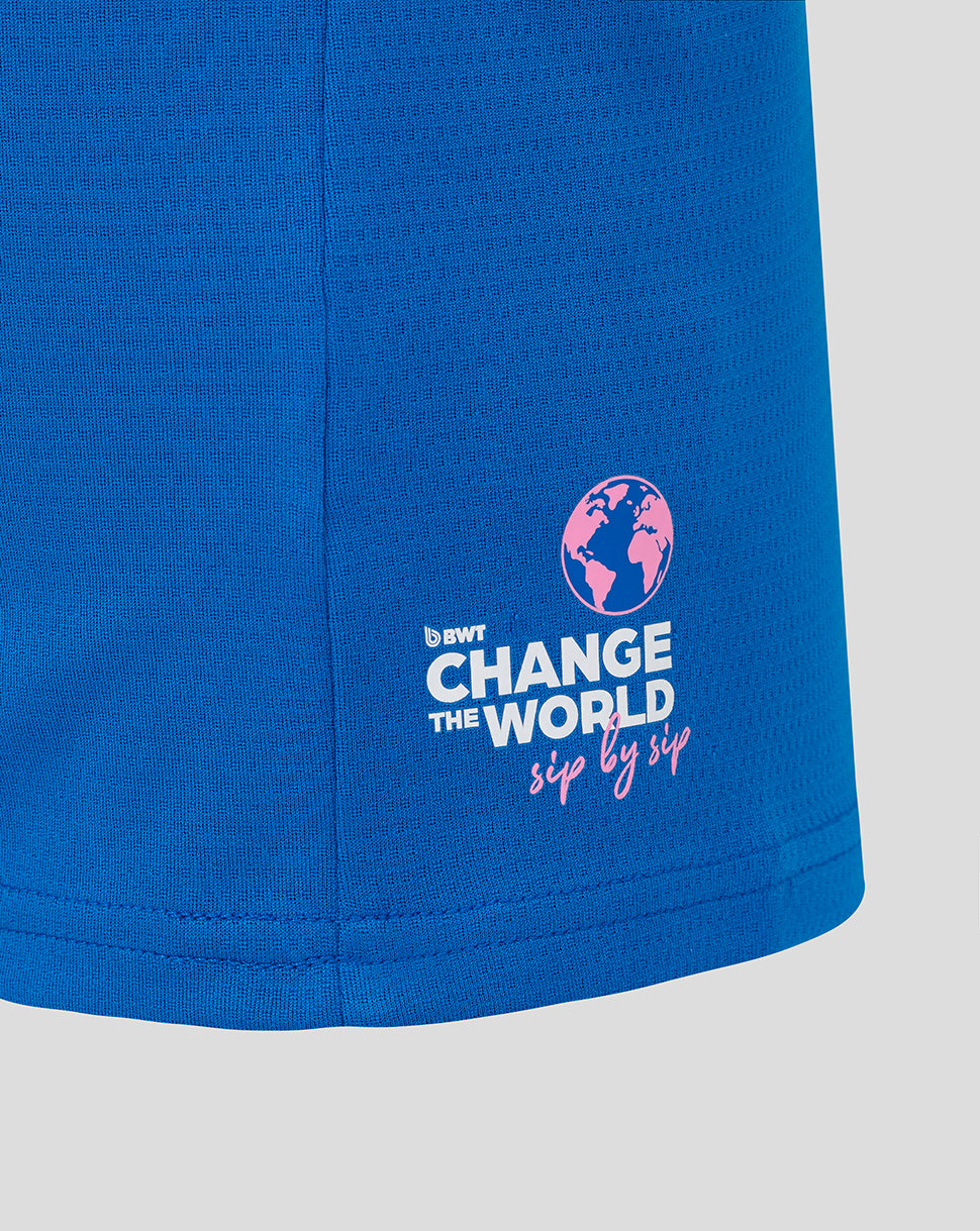 Lower side of blue BWT Alpine polo featuring Change the World logo with pink globe graphic