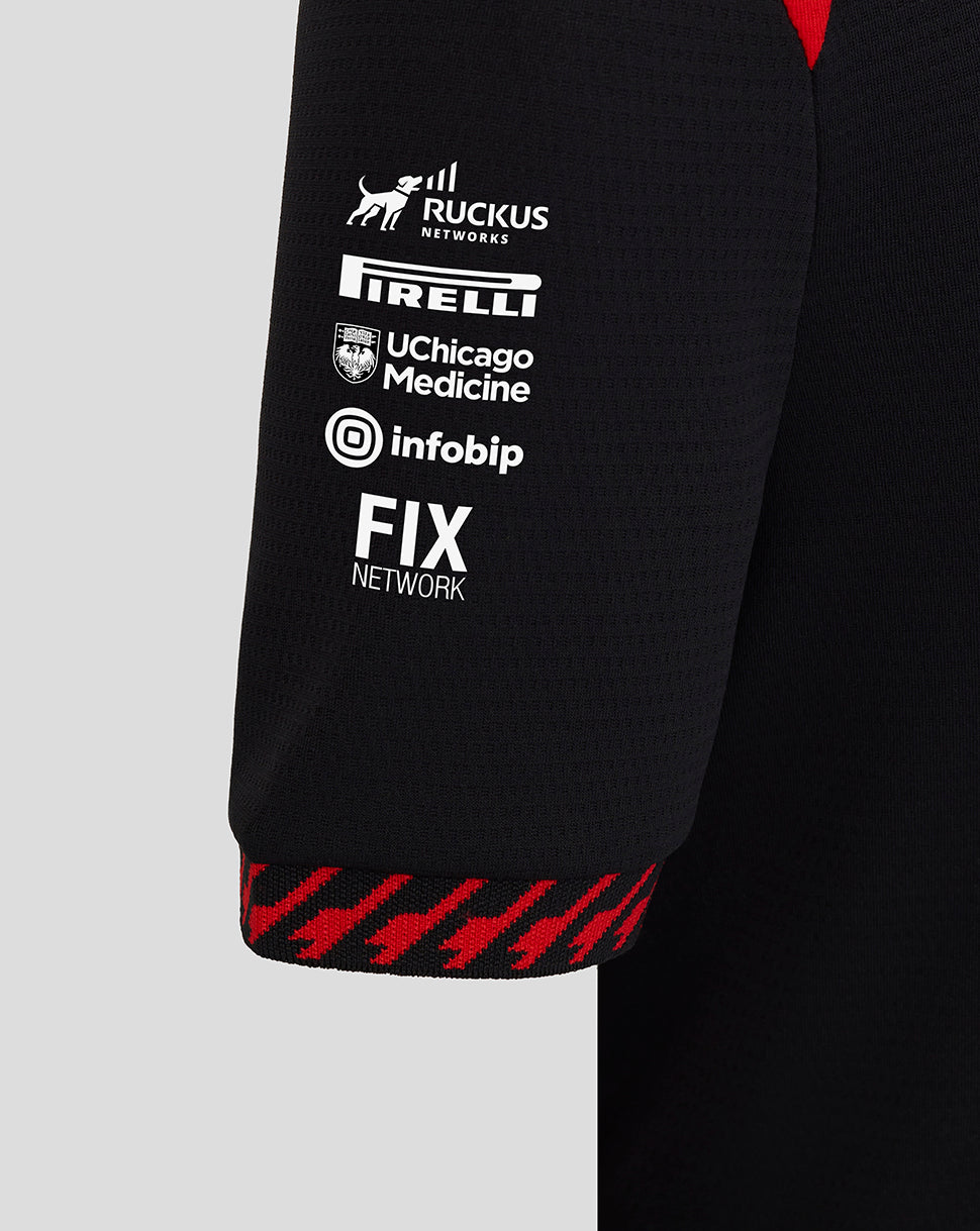 Black sleeve with various brand logos on a gray background