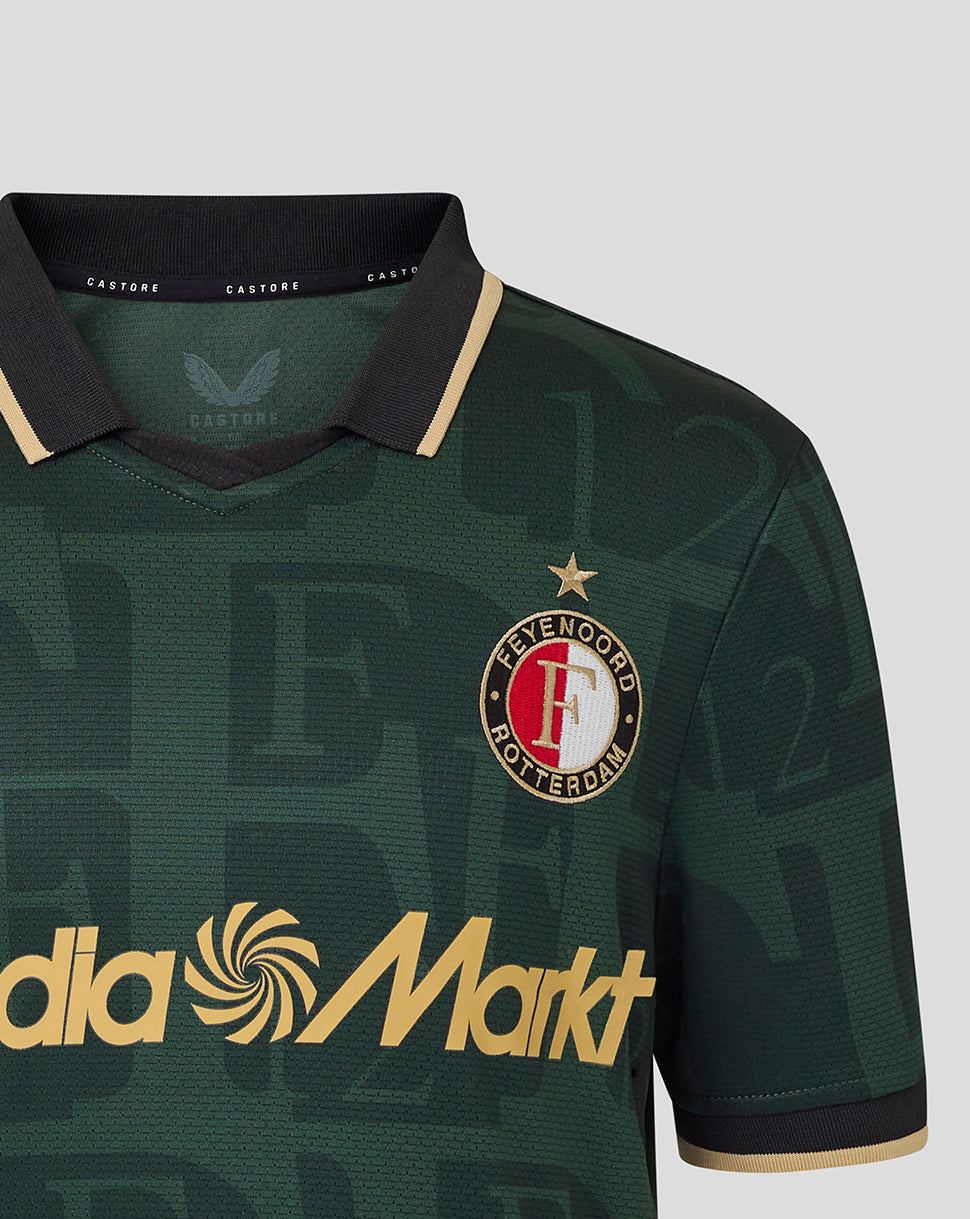 Close-up of chest and shoulder showing Het Legioen crest and MediaMarkt sponsor on green Twelfth Shirt