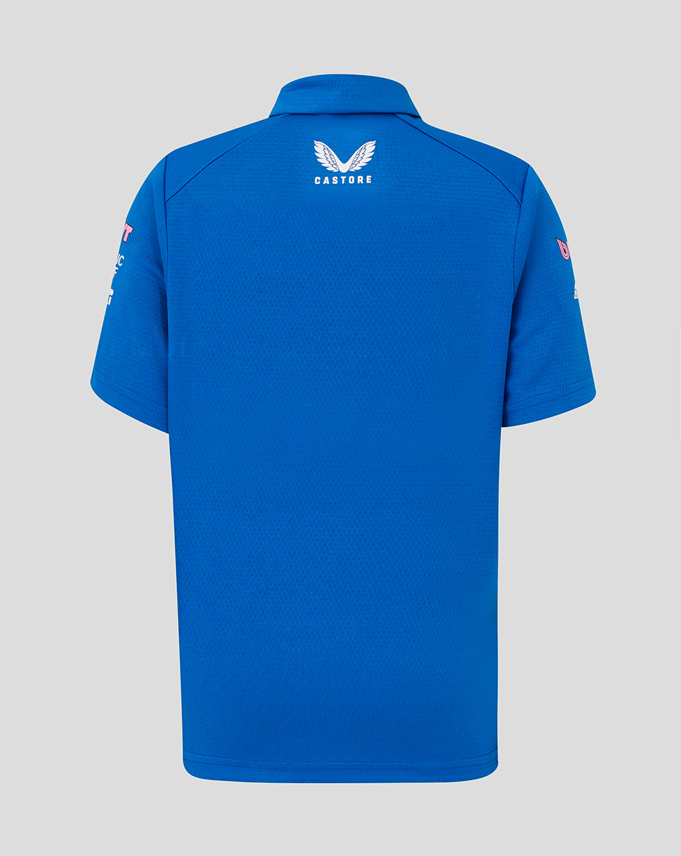 Back view of blue junior BWT Alpine polo with Castore logo at the upper back and branding on sleeves