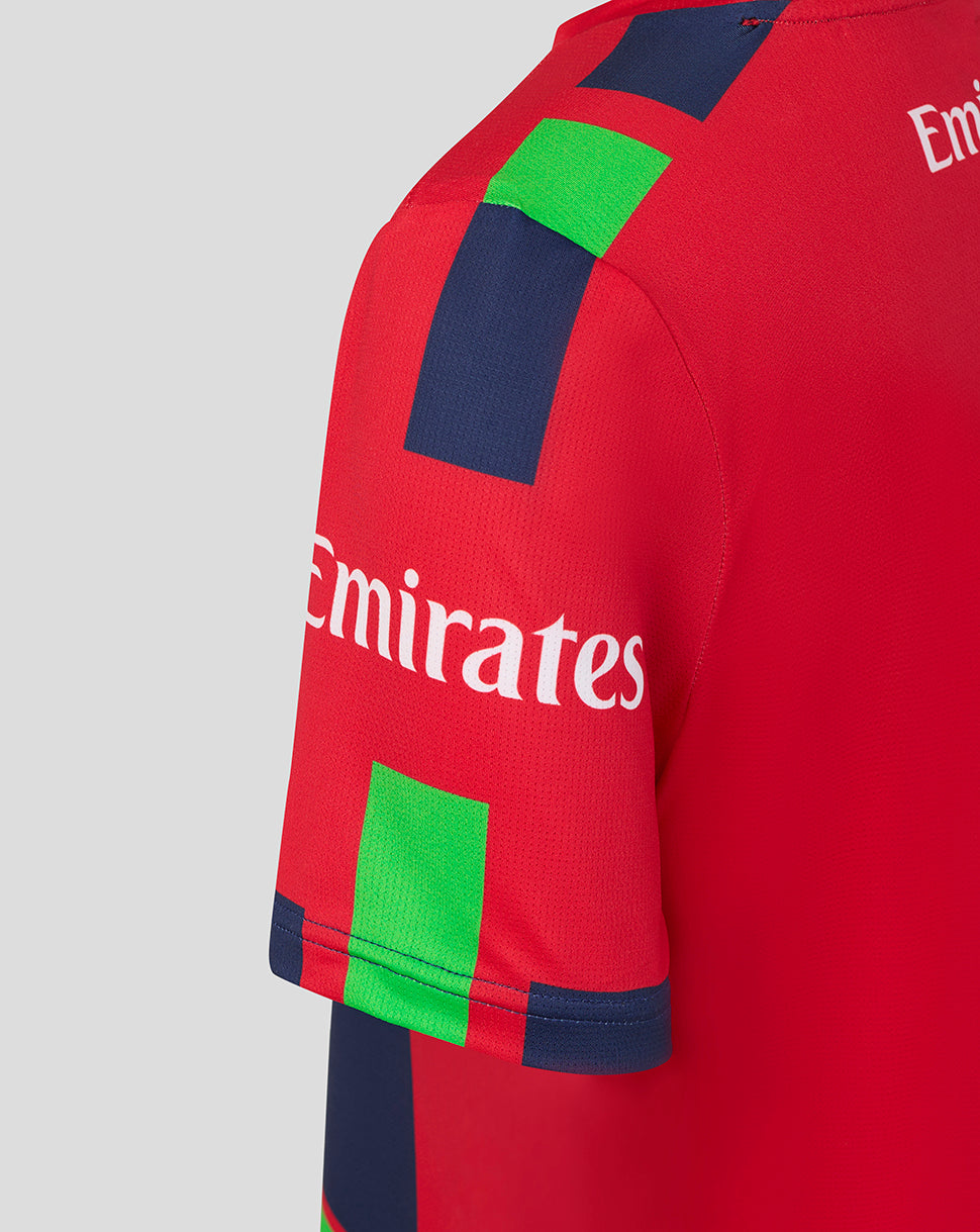 Red sports jersey with Emirates logo on a gray background