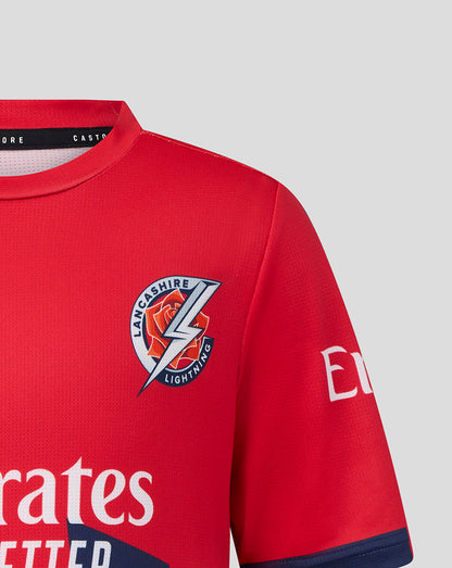 Red sports jersey with a logo and branding on a light gray background