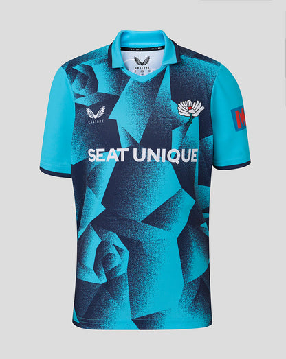 Blue sports jersey with geometric pattern and visible branding on a gray background